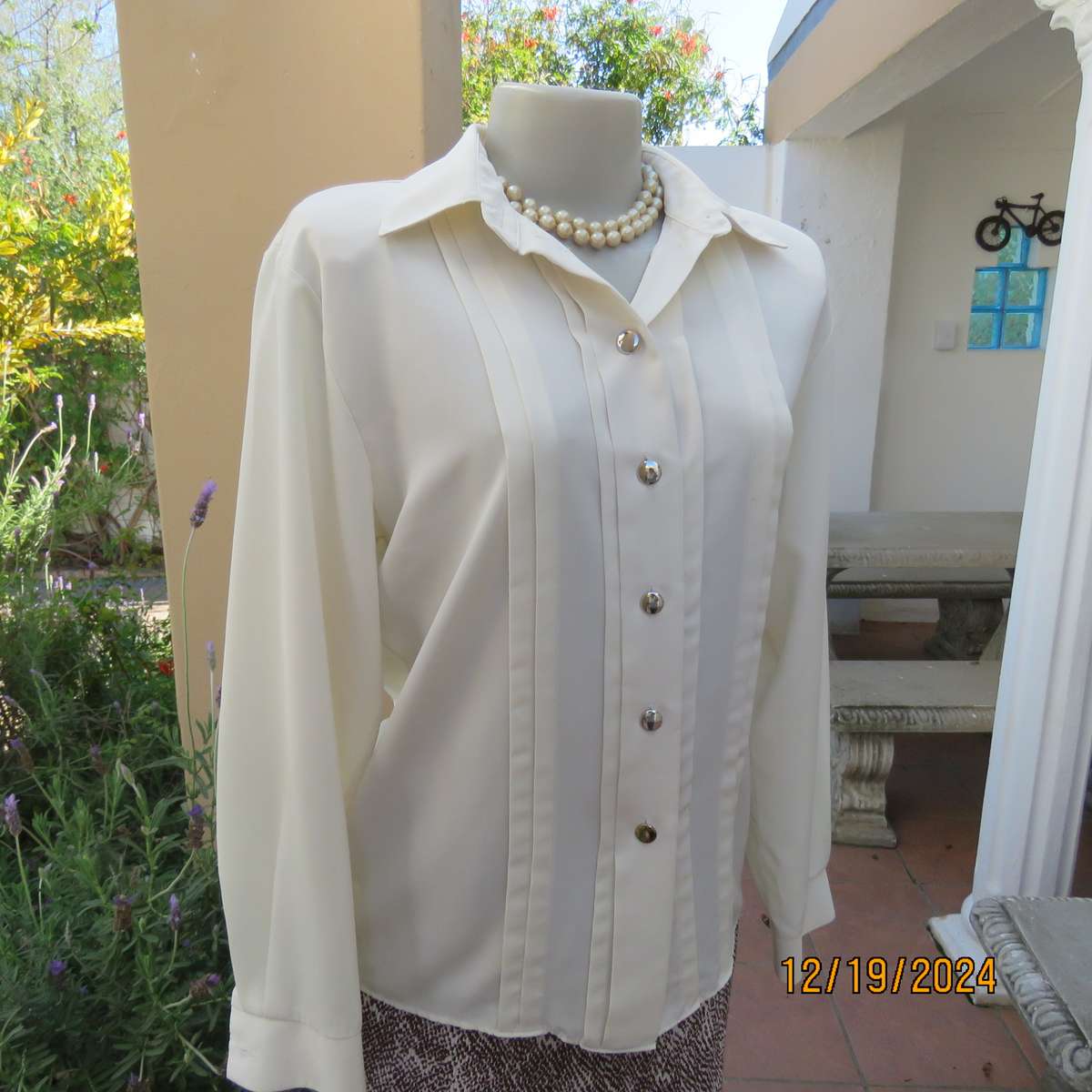 Elegant soft cream long cuffed sleeve top. Button down/shirt collar.Decorative tucked seams. Size 36