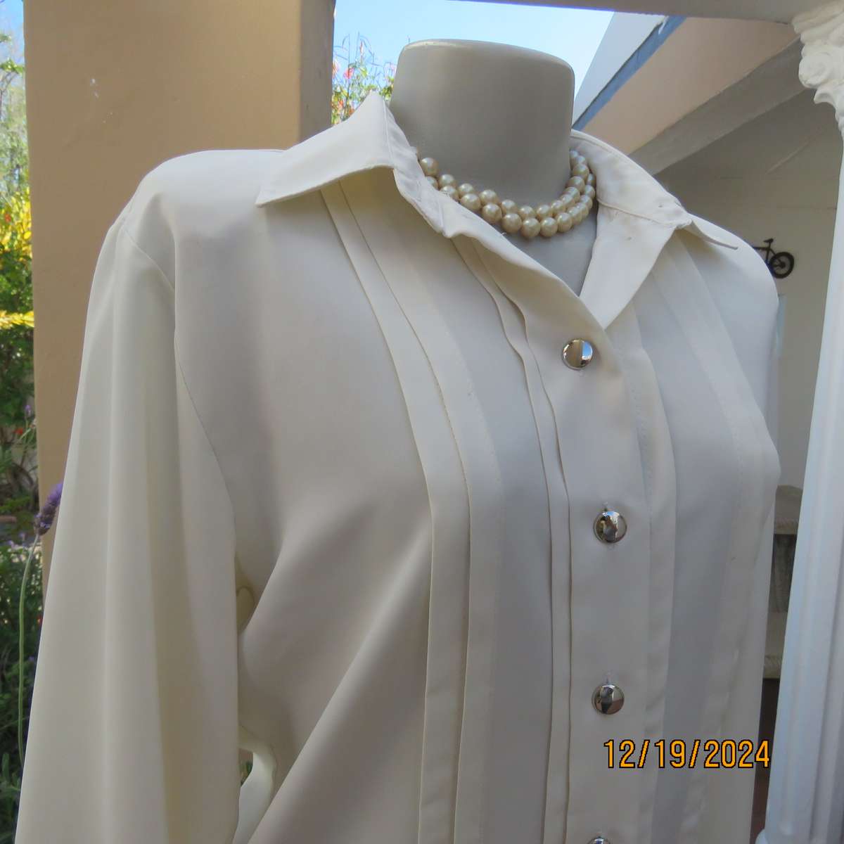 Elegant soft cream long cuffed sleeve top. Button down/shirt collar.Decorative tucked seams. Size 36