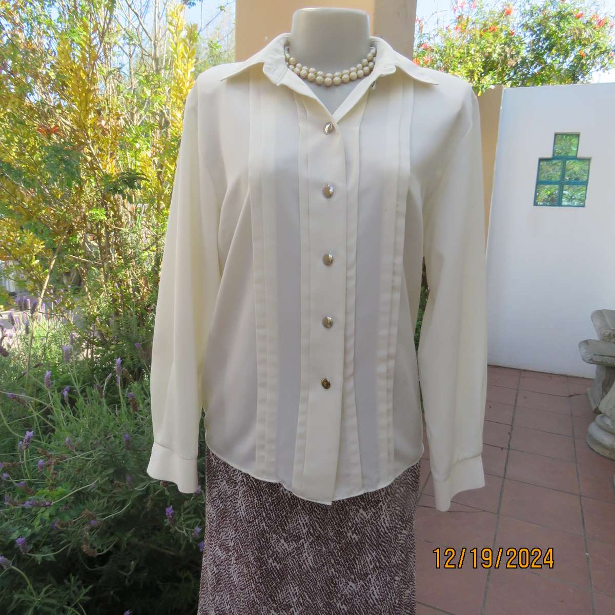 Elegant soft cream long cuffed sleeve top. Button down/shirt collar.Decorative tucked seams. Size 36