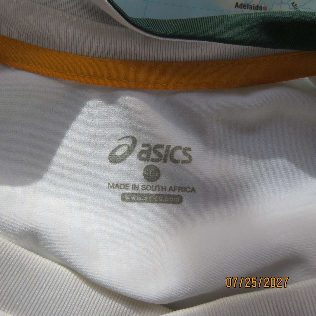 ASICS white SA Rugby stretch polyester top. With dark green-protea badge. Size Med