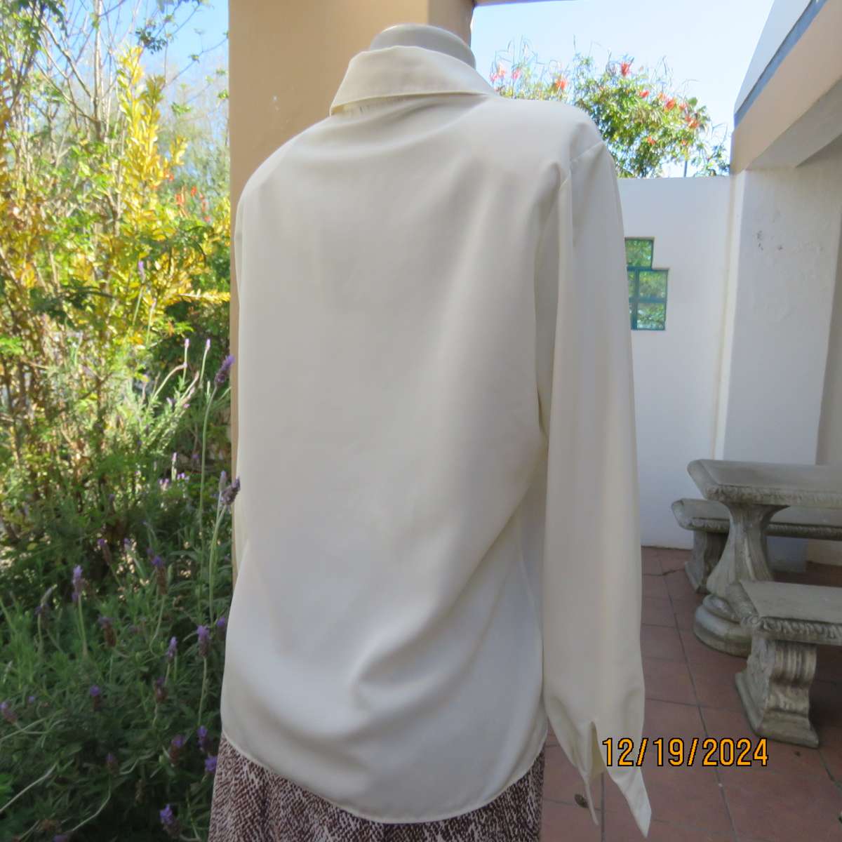 Elegant soft cream long cuffed sleeve top. Button down/shirt collar.Decorative tucked seams. Size 36