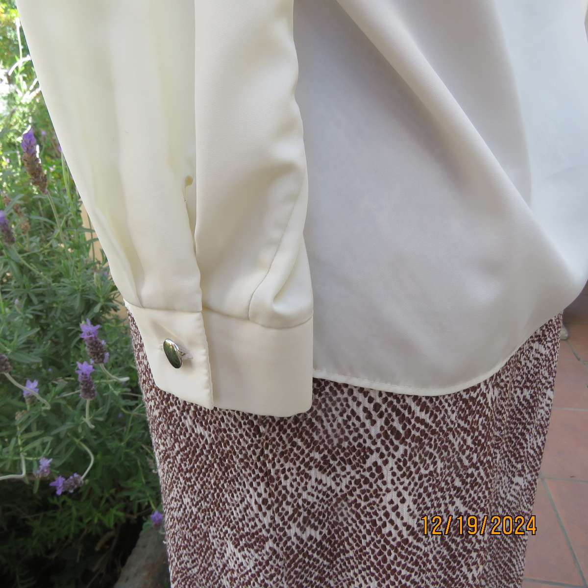 Elegant soft cream long cuffed sleeve top. Button down/shirt collar.Decorative tucked seams. Size 36