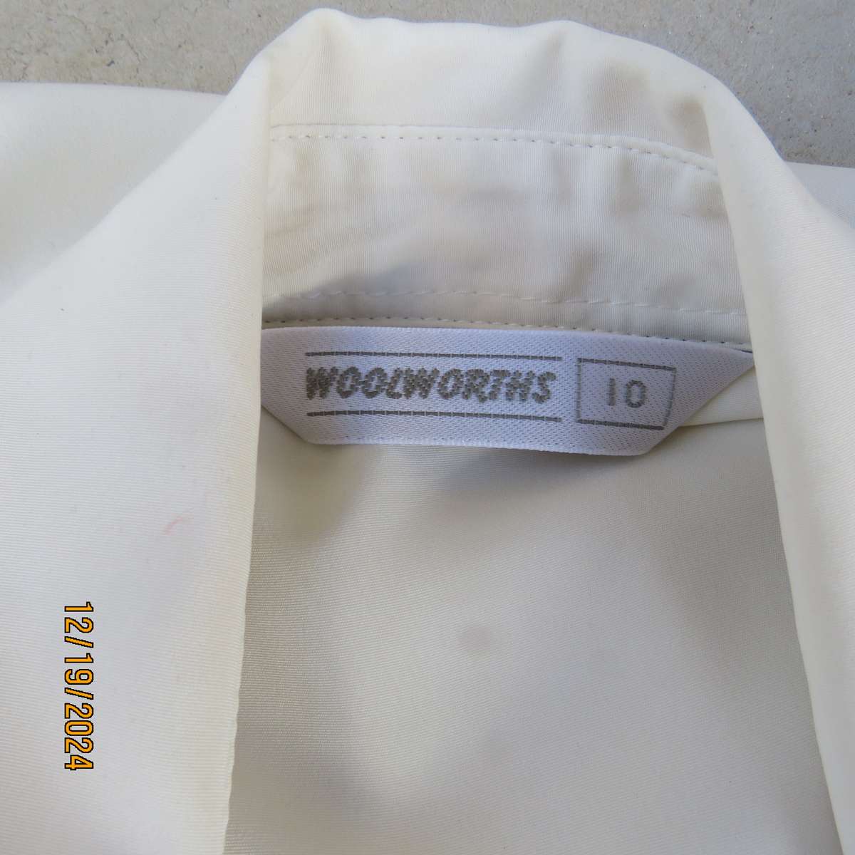 Elegant soft cream long cuffed sleeve top. Button down/shirt collar.Decorative tucked seams. Size 36