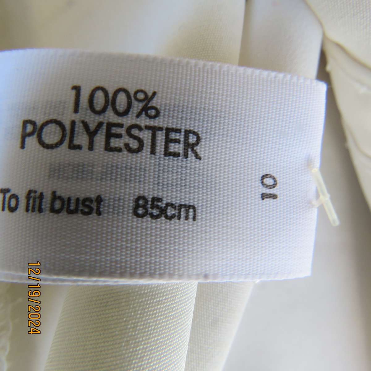 Elegant soft cream long cuffed sleeve top. Button down/shirt collar.Decorative tucked seams. Size 36