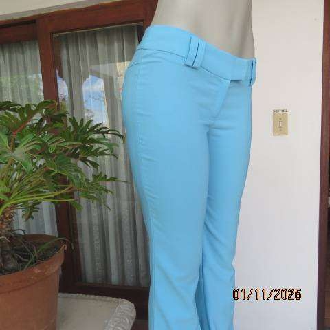 URB cornflower blue low rise size 32 flare leg stretch polyester pants.