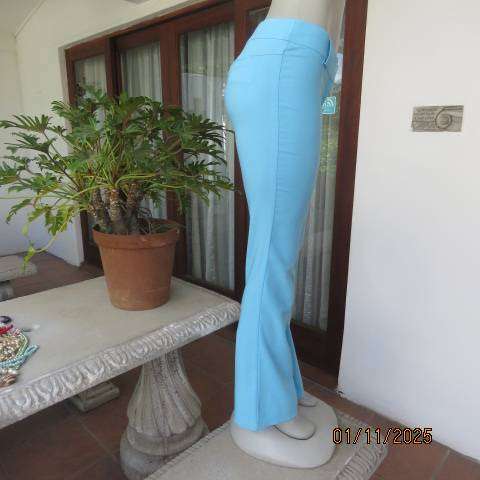 URB cornflower blue low rise size 32 flare leg stretch polyester pants.