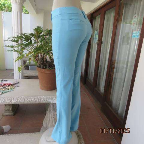 URB cornflower blue low rise size 32 flare leg stretch polyester pants.