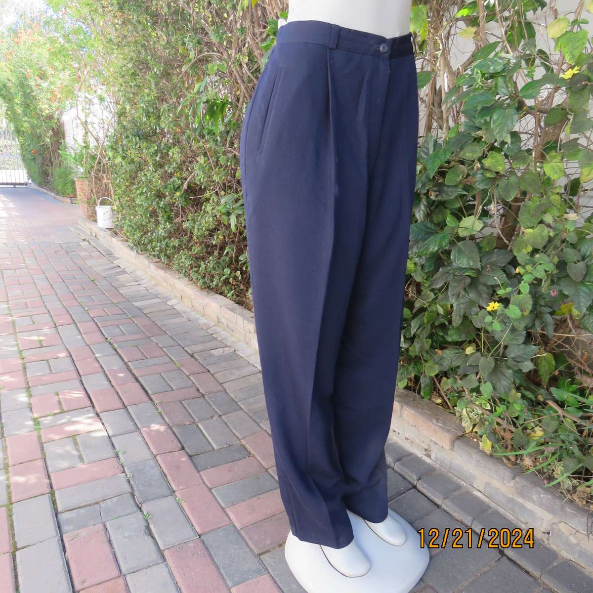 Classic navy poly/viscose dress pants with pleats on front.Size 40. Straight tapered legs.WOOLWORTHS
