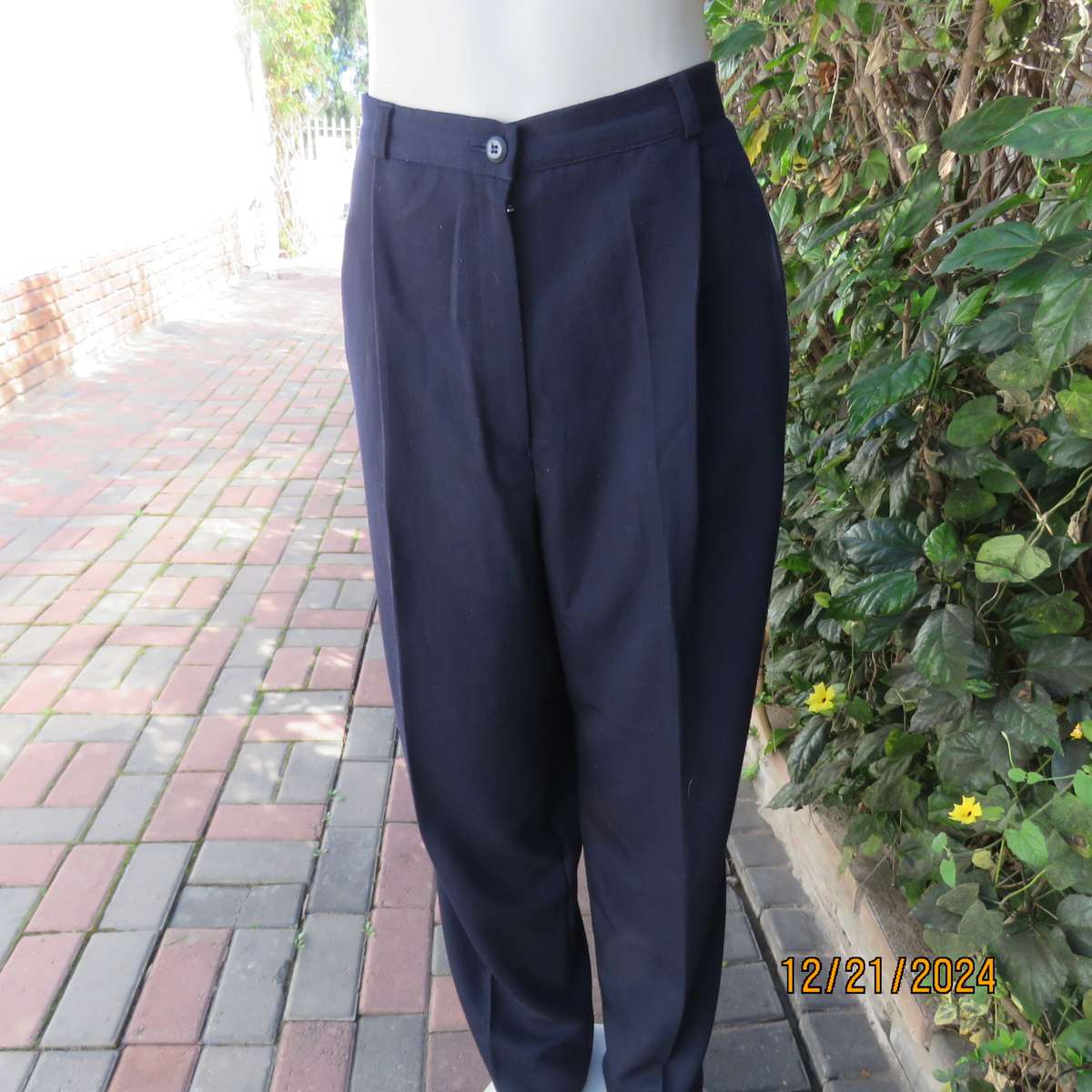 Classic navy poly/viscose dress pants with pleats on front.Size 40. Straight tapered legs.WOOLWORTHS