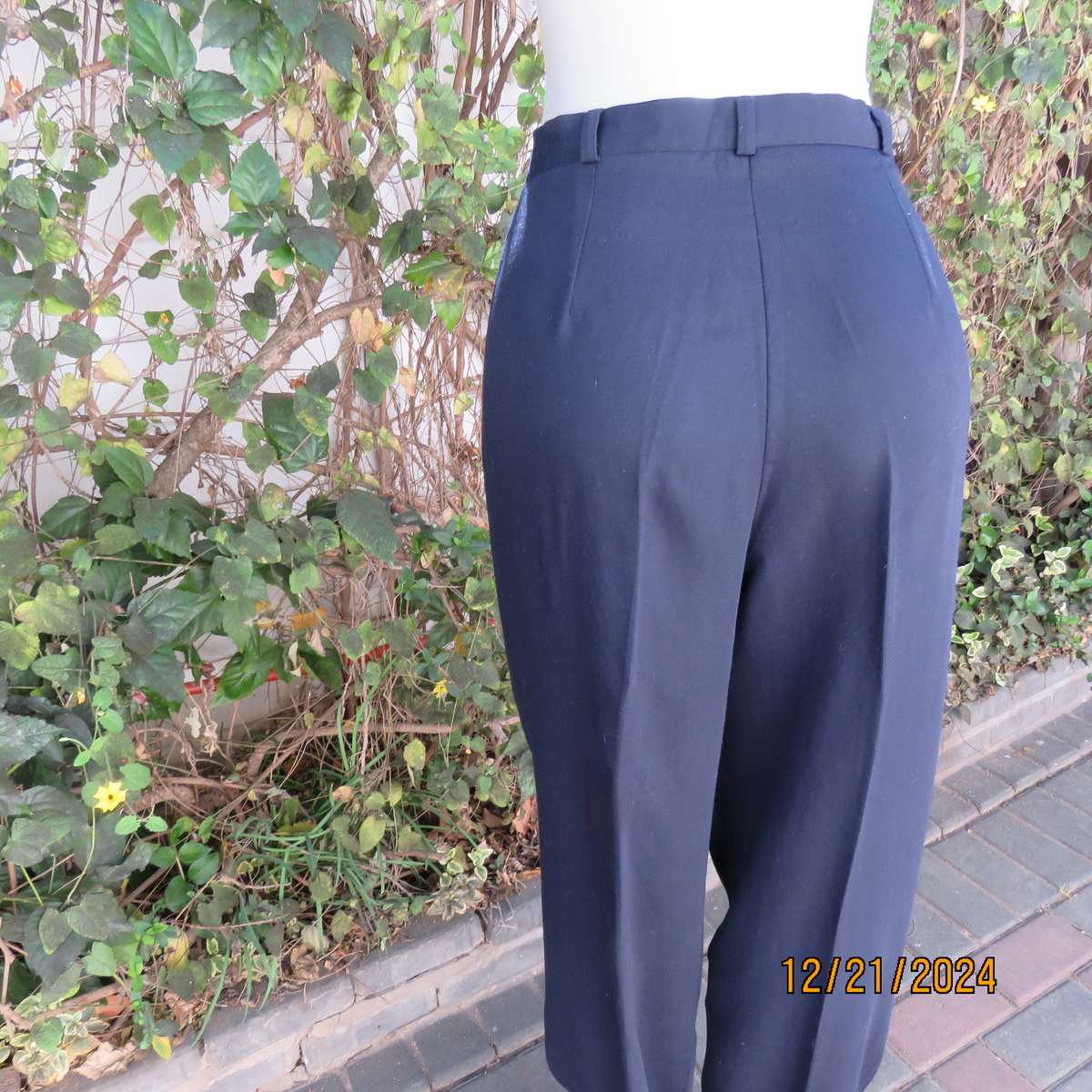 Classic navy poly/viscose dress pants with pleats on front.Size 40. Straight tapered legs.WOOLWORTHS