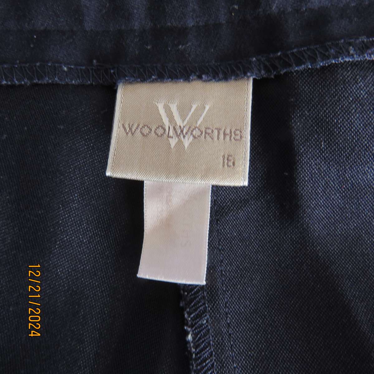 Classic navy poly/viscose dress pants with pleats on front.Size 40. Straight tapered legs.WOOLWORTHS
