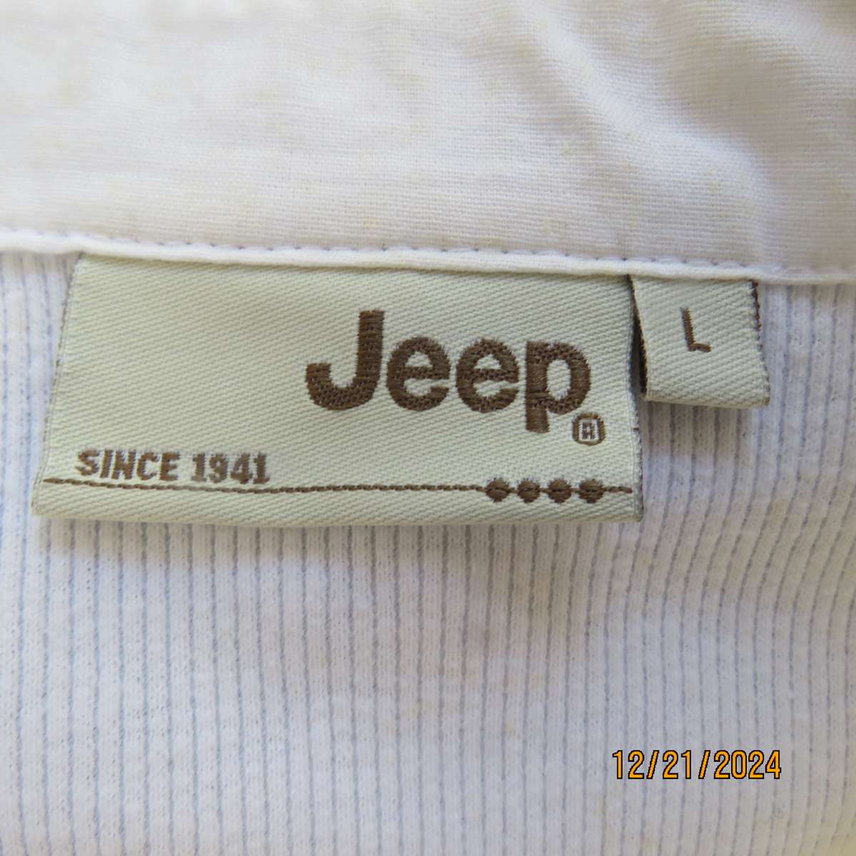High quality white JEEP Top with Banded V neck and collar. Size 38. Capped sleeves. New cond.