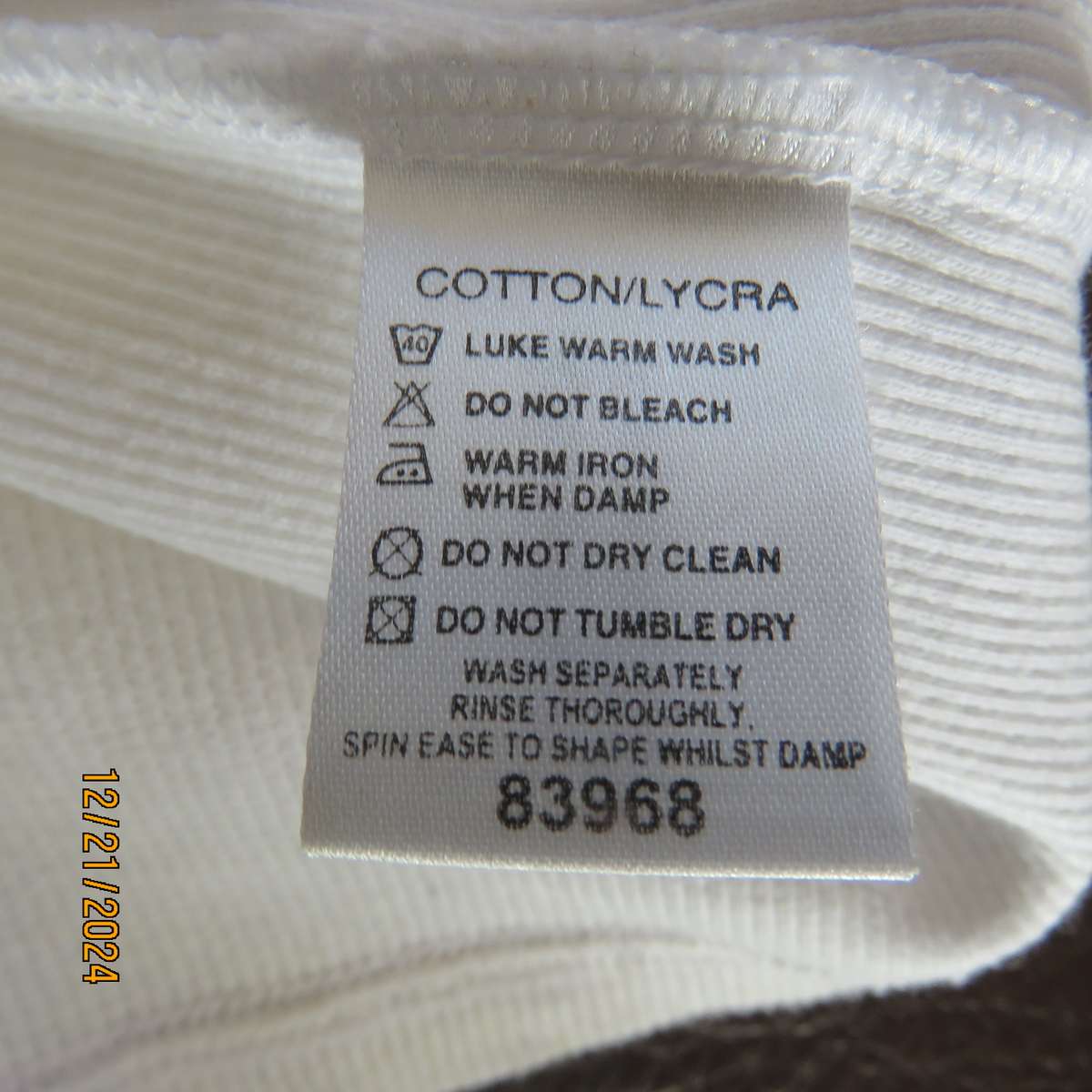 High quality white JEEP Top with Banded V neck and collar. Size 38. Capped sleeves. New cond.