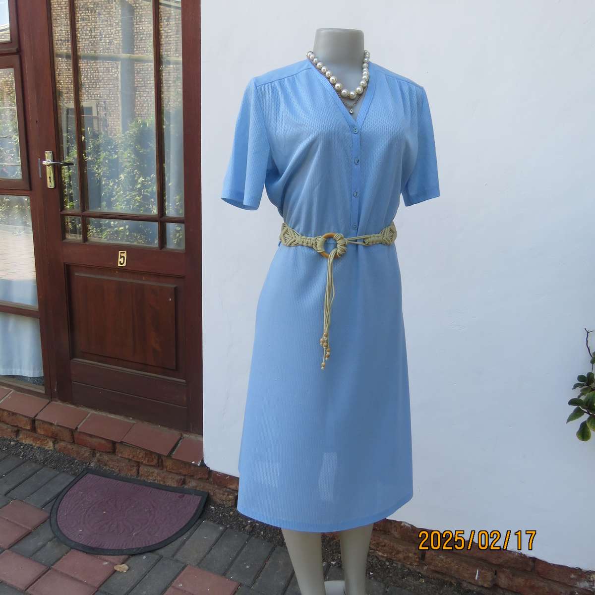 Vintage power blue poly-nylon short sleeve dress. Button down V neck top. A line bottom.Size 36.