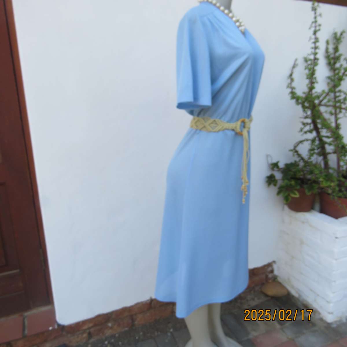 Vintage power blue poly-nylon short sleeve dress. Button down V neck top. A line bottom.Size 36.