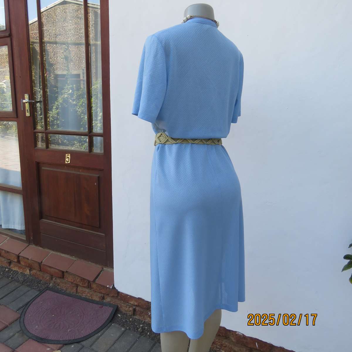 Vintage power blue poly-nylon short sleeve dress. Button down V neck top. A line bottom.Size 36.