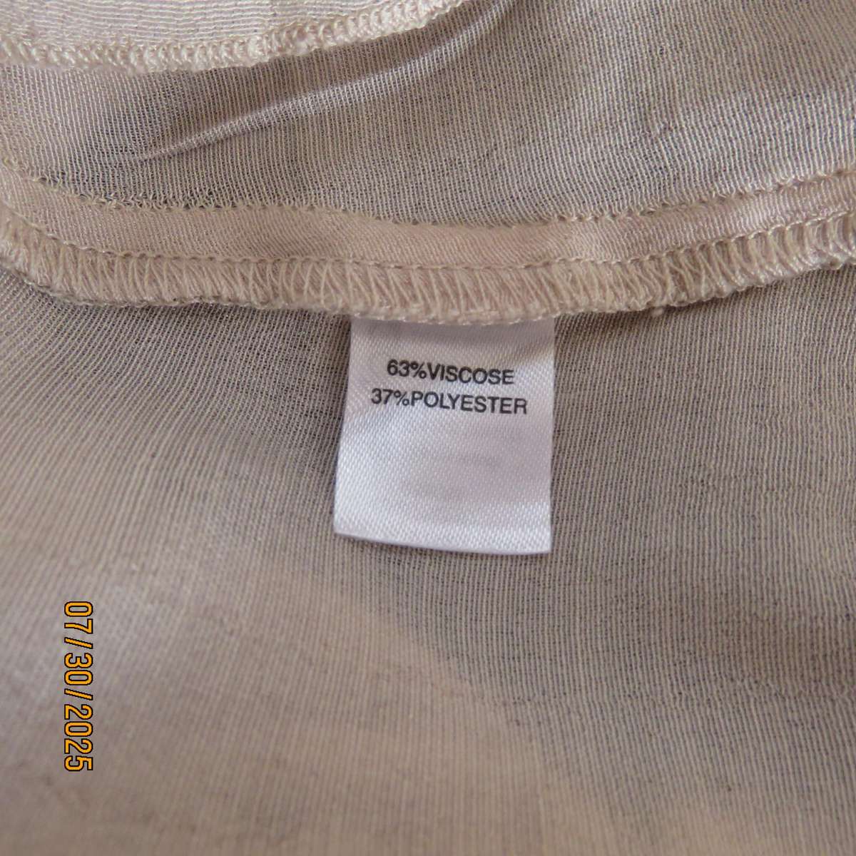 EXACT rich cream viscose-polyester slip over frilled V neck top. Size 44