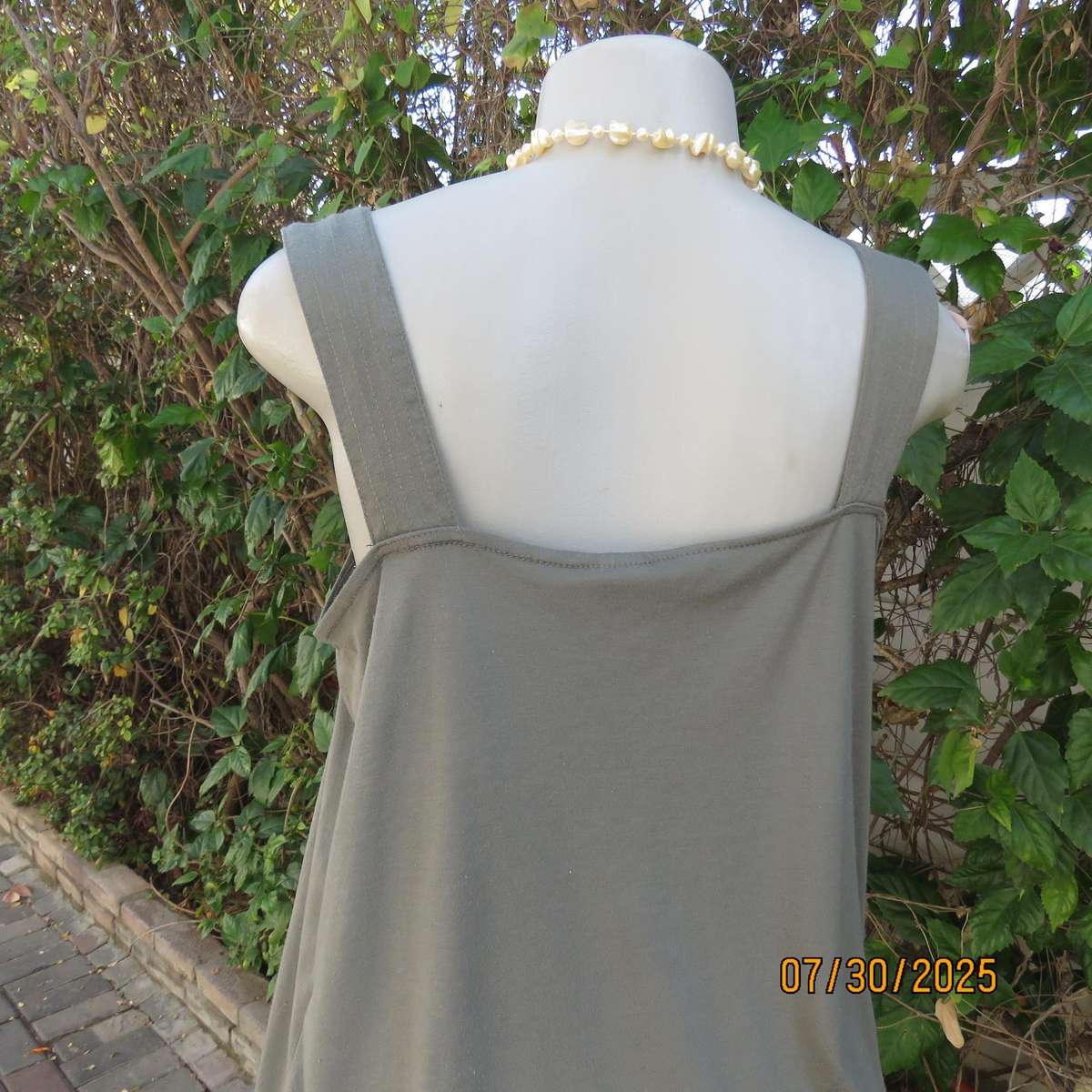 Olive green poly-viscose slip over top with scooped neckline. Pleats on front. Size 38