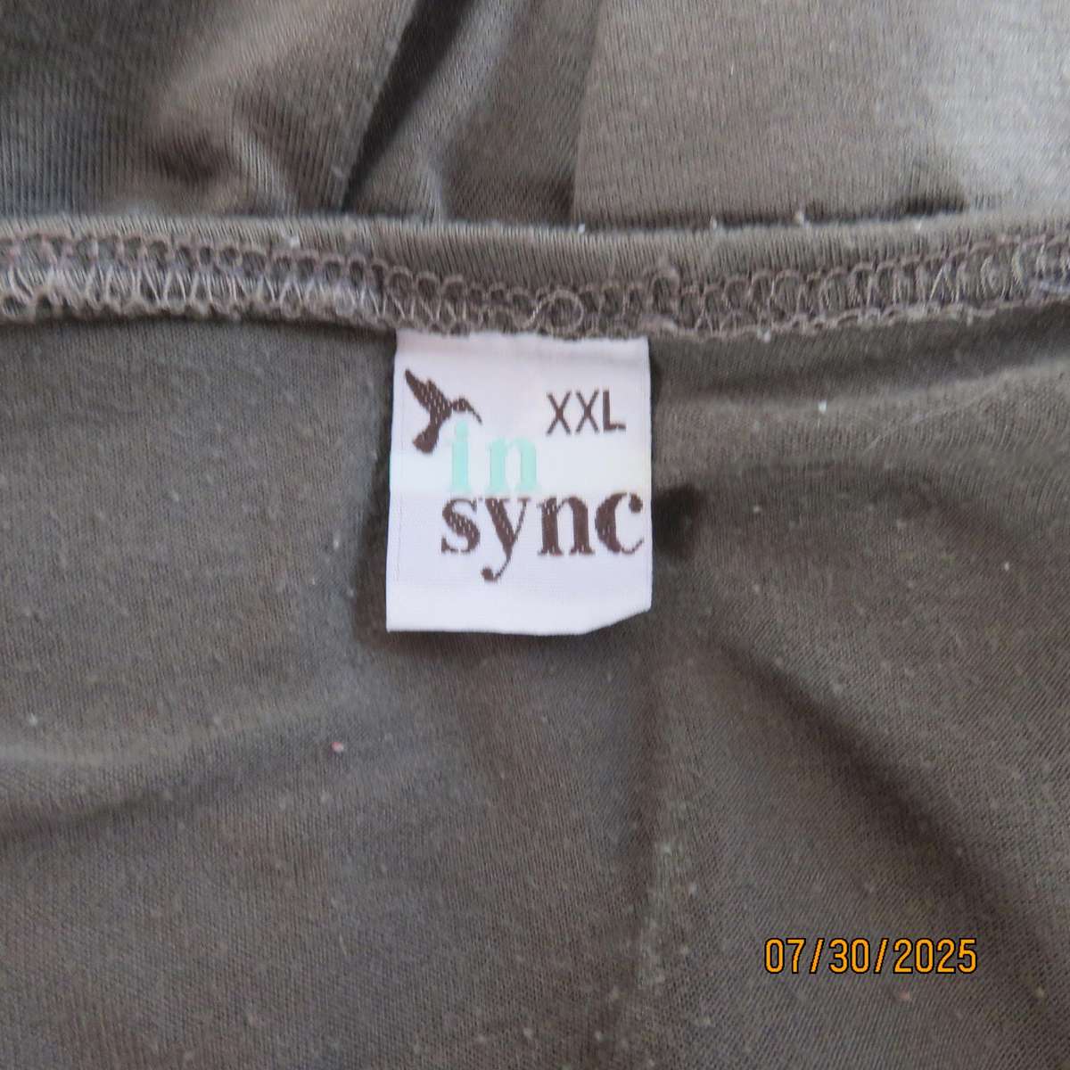 Olive green poly-viscose slip over top with scooped neckline. Pleats on front. Size 38