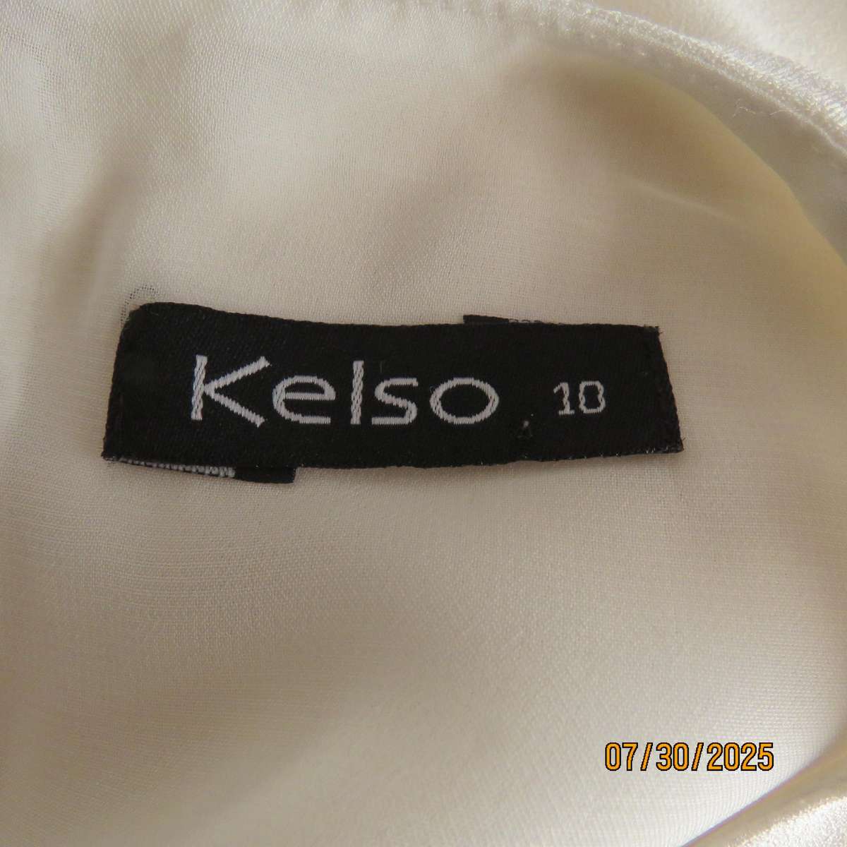 KELSO light cream sleeveless slip over size 34 top. Polyester with lining.