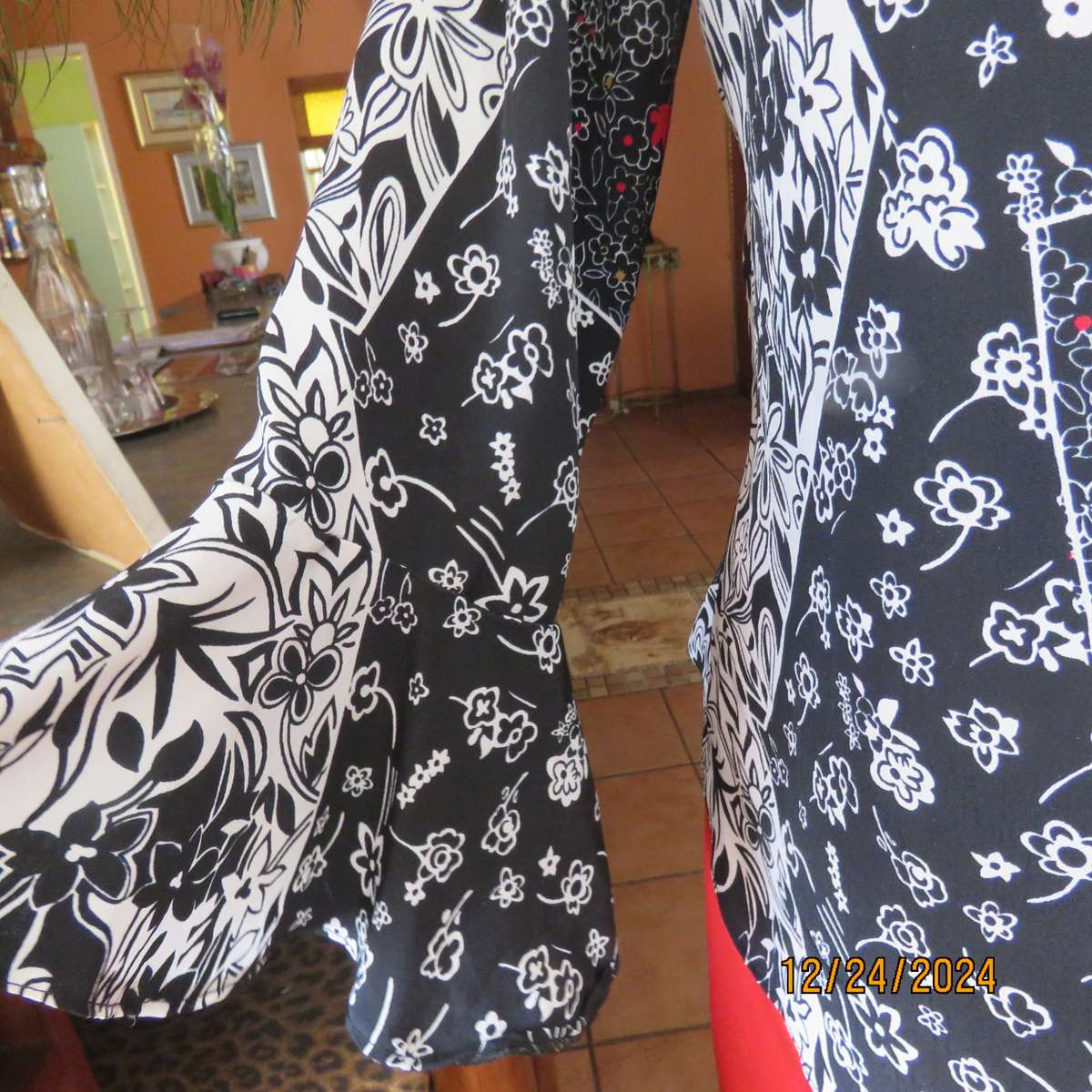 Unique flare cuffed long sleeve top in black/red/white pattern blocks. Button down.Size 37. AS new