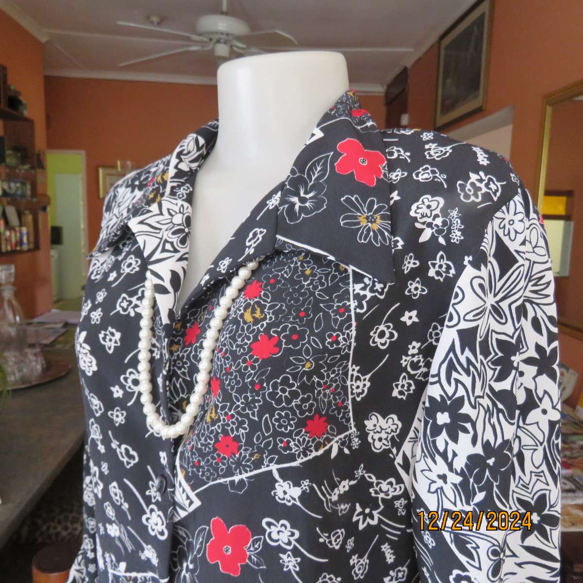 Unique flare cuffed long sleeve top in black/red/white pattern blocks. Button down.Size 37. AS new