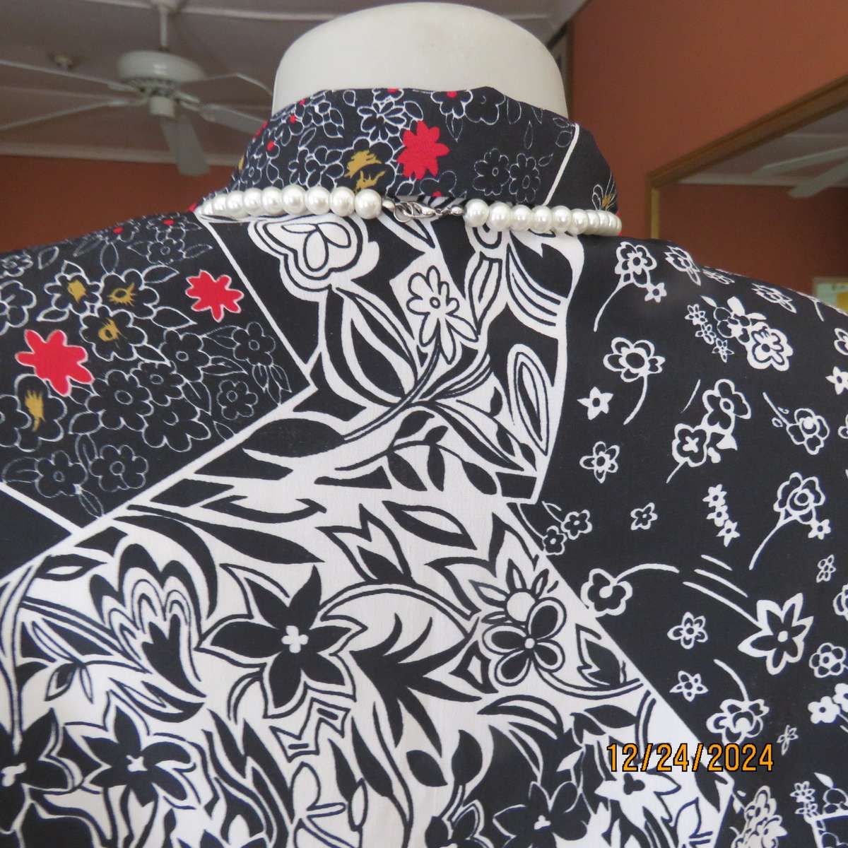 Unique flare cuffed long sleeve top in black/red/white pattern blocks. Button down.Size 37. AS new
