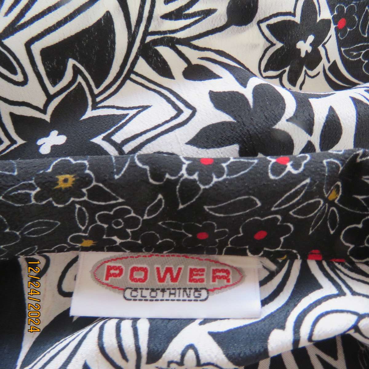 Unique flare cuffed long sleeve top in black/red/white pattern blocks. Button down.Size 37. AS new