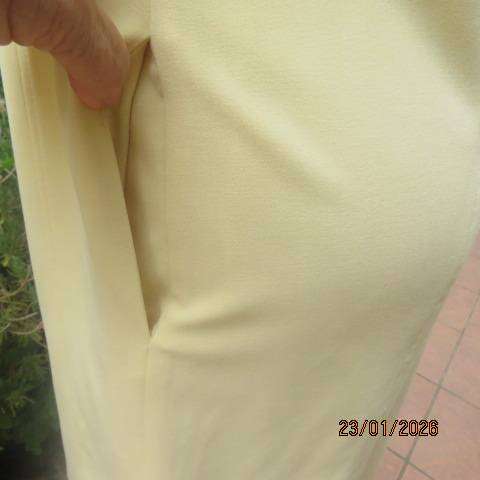 MILADYS banana yellow 2 pc suite. Bootlegged dress pants. Long lined jacket-coat. Size 37
