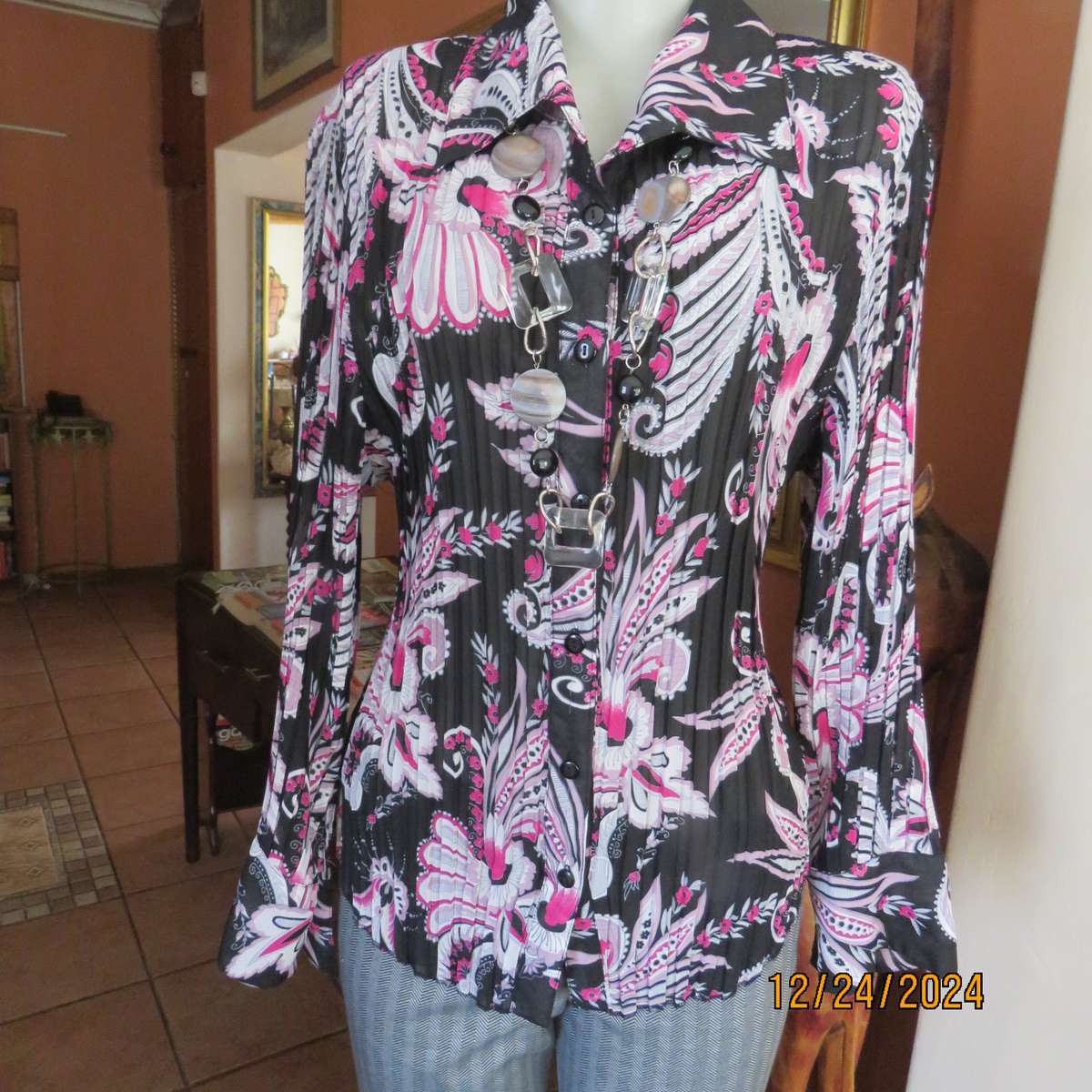 Permanent pleated black/pink/white bo-ho patterned button down long sleeve top. Size 40. Sheer poly.