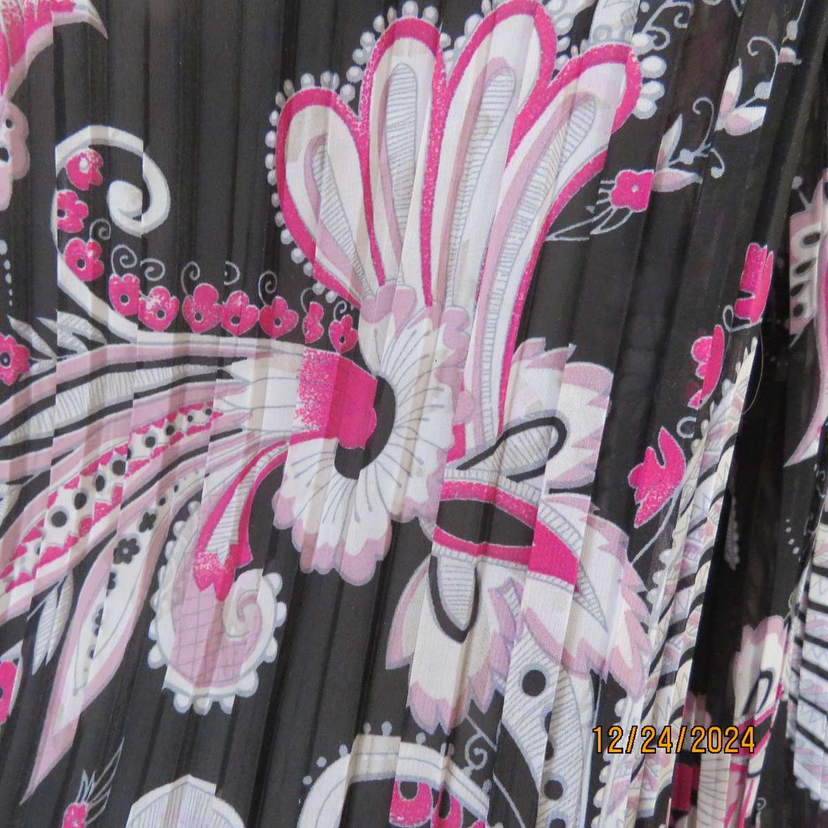 Permanent pleated black/pink/white bo-ho patterned button down long sleeve top. Size 40. Sheer poly.