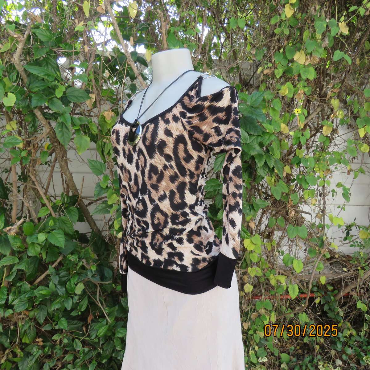 INWEAR animal print long sleeve naked shoulder and chrome link top size 32.