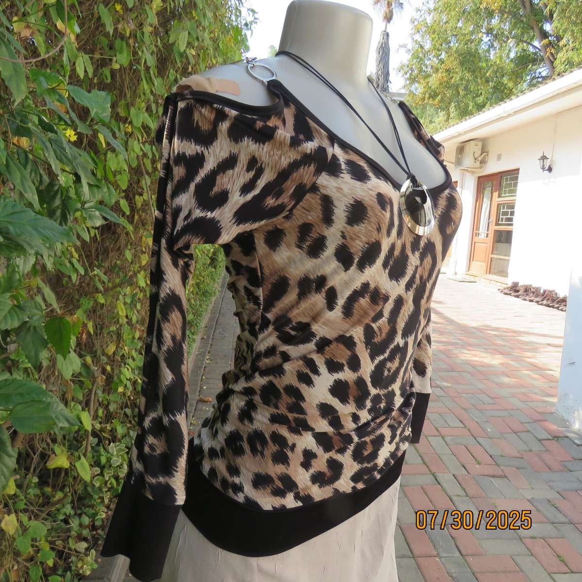INWEAR animal print long sleeve naked shoulder and chrome link top size 32.