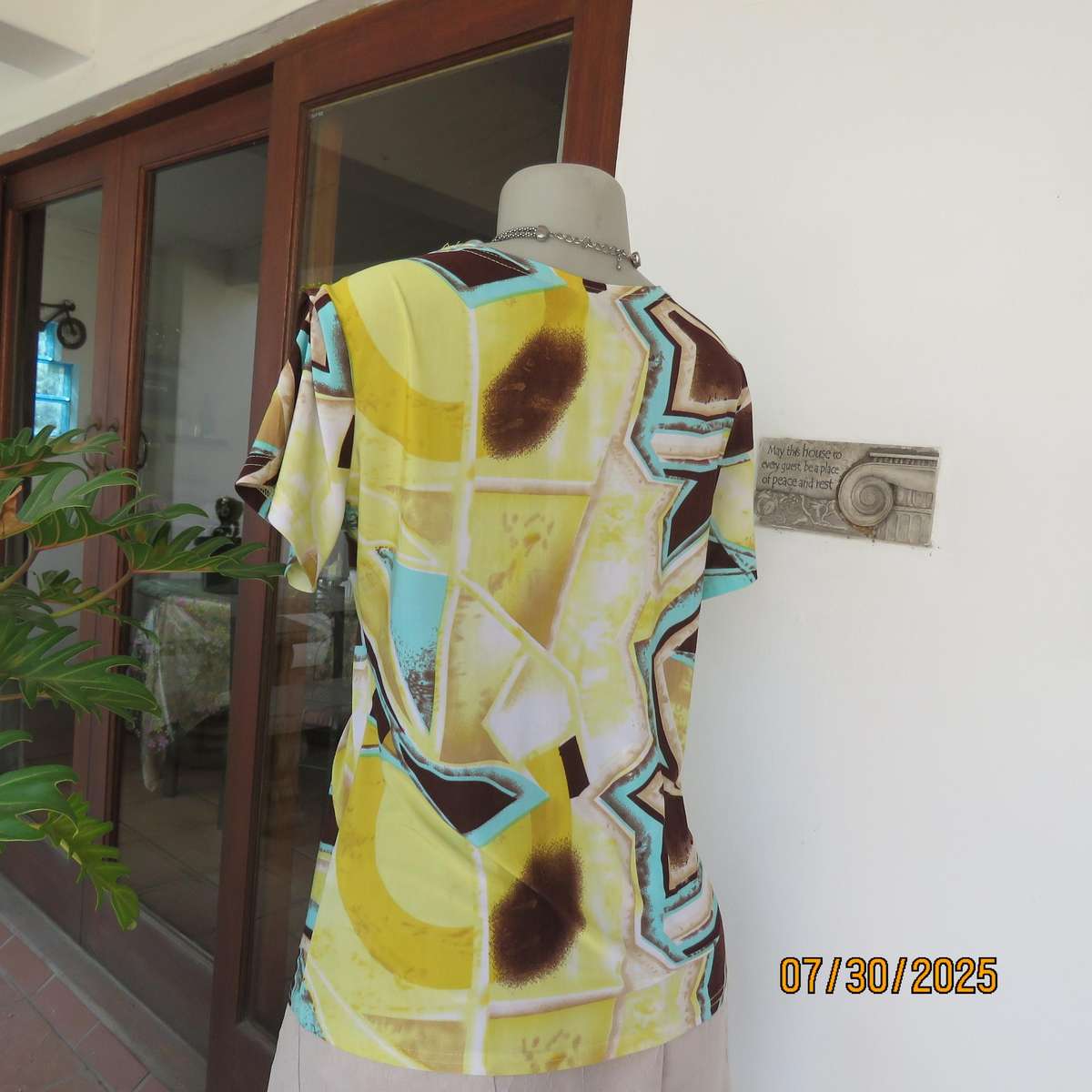 FASHION Express size 38 geometric printed V neck stretch top.