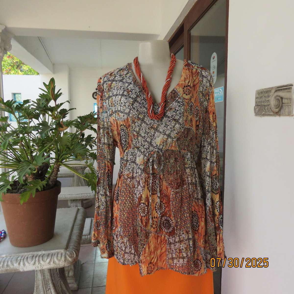 Autumn colour permanent creased size 44 long sleeve empire style top.