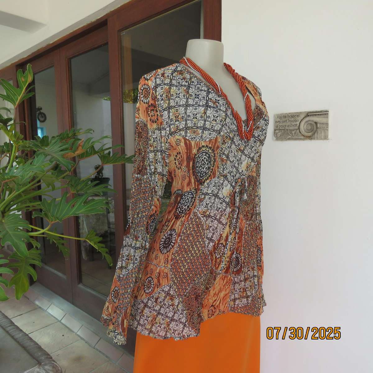 Autumn colour permanent creased size 44 long sleeve empire style top.