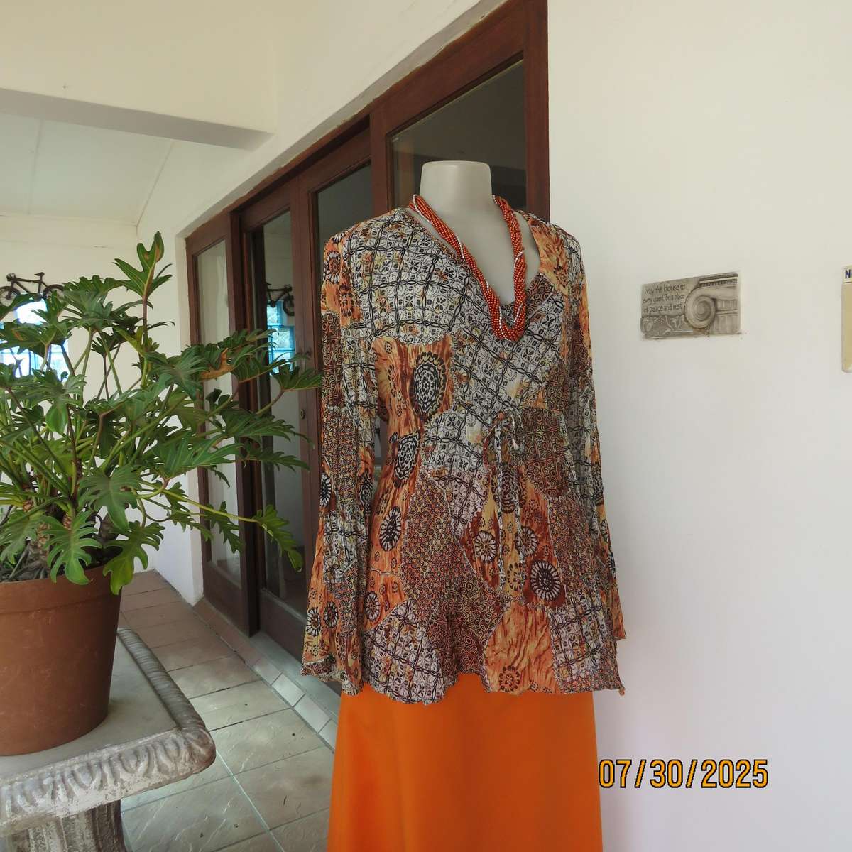 Autumn colour permanent creased size 44 long sleeve empire style top.