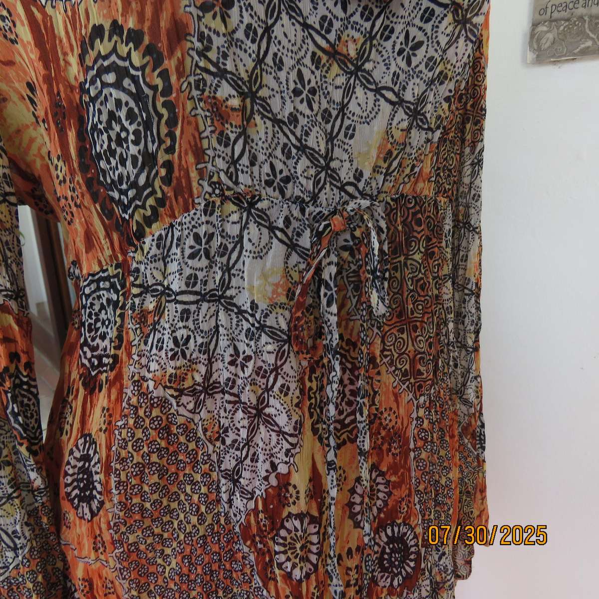 Autumn colour permanent creased size 44 long sleeve empire style top.