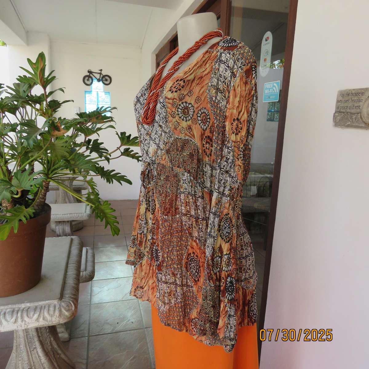 Autumn colour permanent creased size 44 long sleeve empire style top.