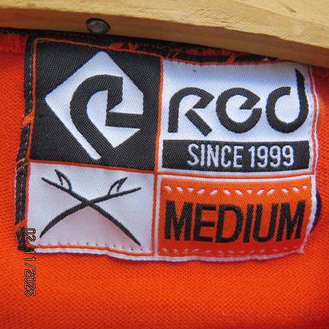 Men's red long sleeve polyester knit pull over sweater in size Medium.