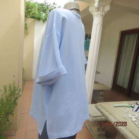 Misty blue slip over ribbed polycotton top with short sleeves with turnovers. Size 48