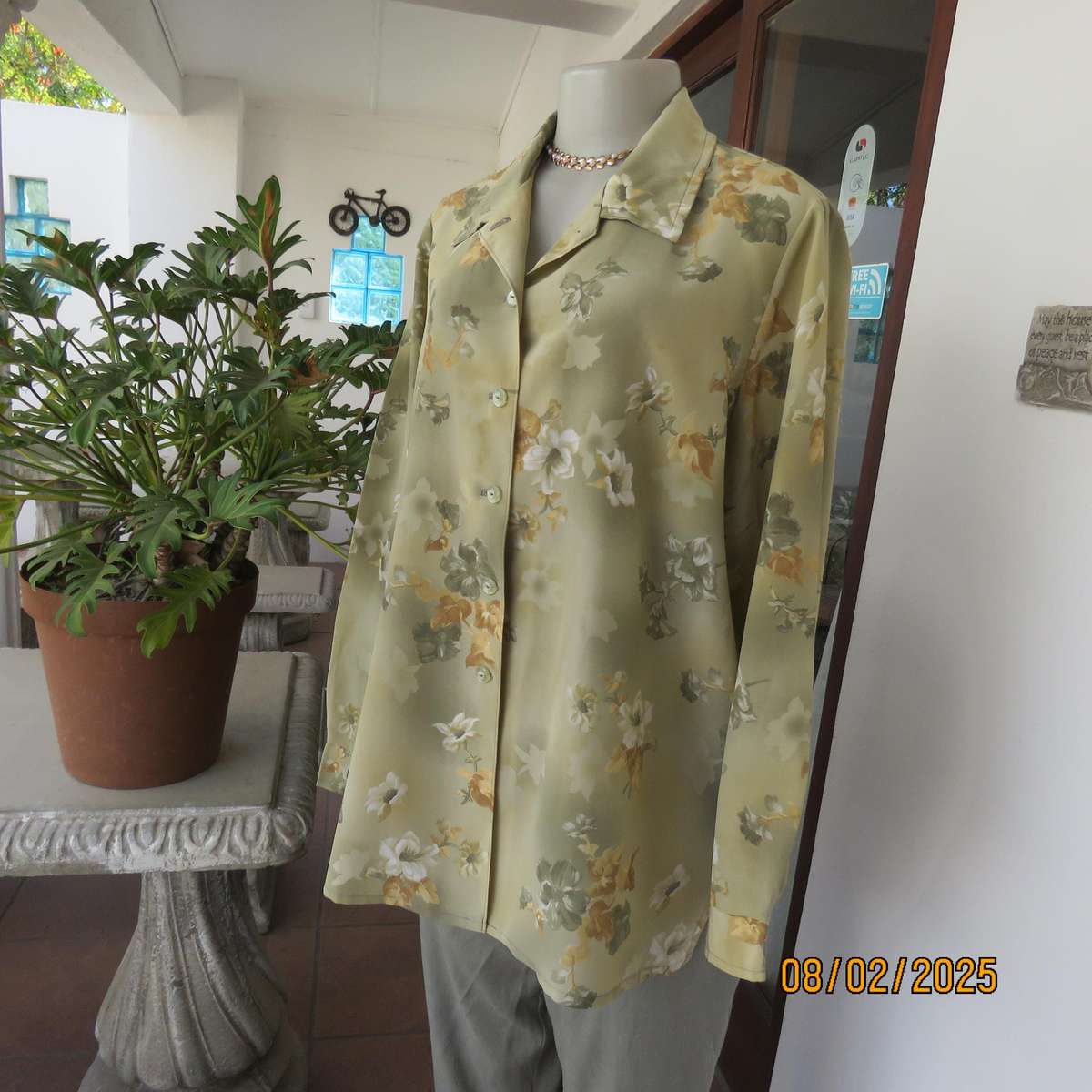 Moss green textured polyester long sleeve top with green-gold flowers. Size 44