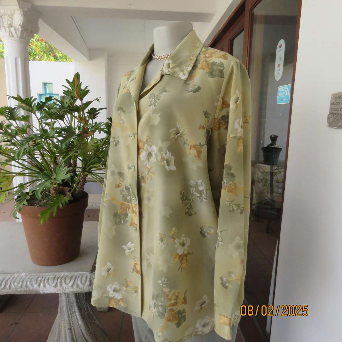 Moss green textured polyester long sleeve top with green-gold flowers. Size 44