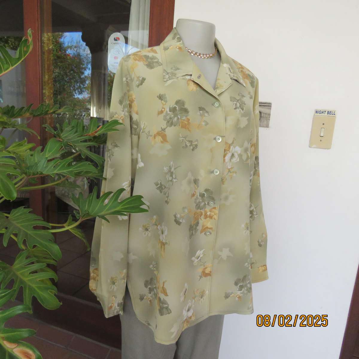 Moss green textured polyester long sleeve top with green-gold flowers. Size 44