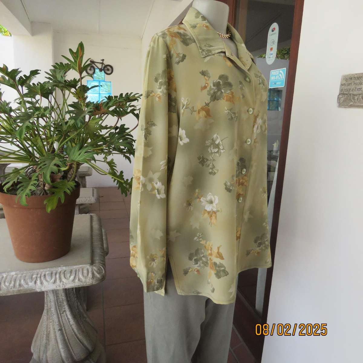 Moss green textured polyester long sleeve top with green-gold flowers. Size 44