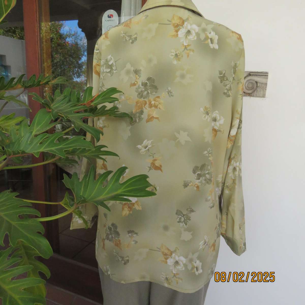 Moss green textured polyester long sleeve top with green-gold flowers. Size 44