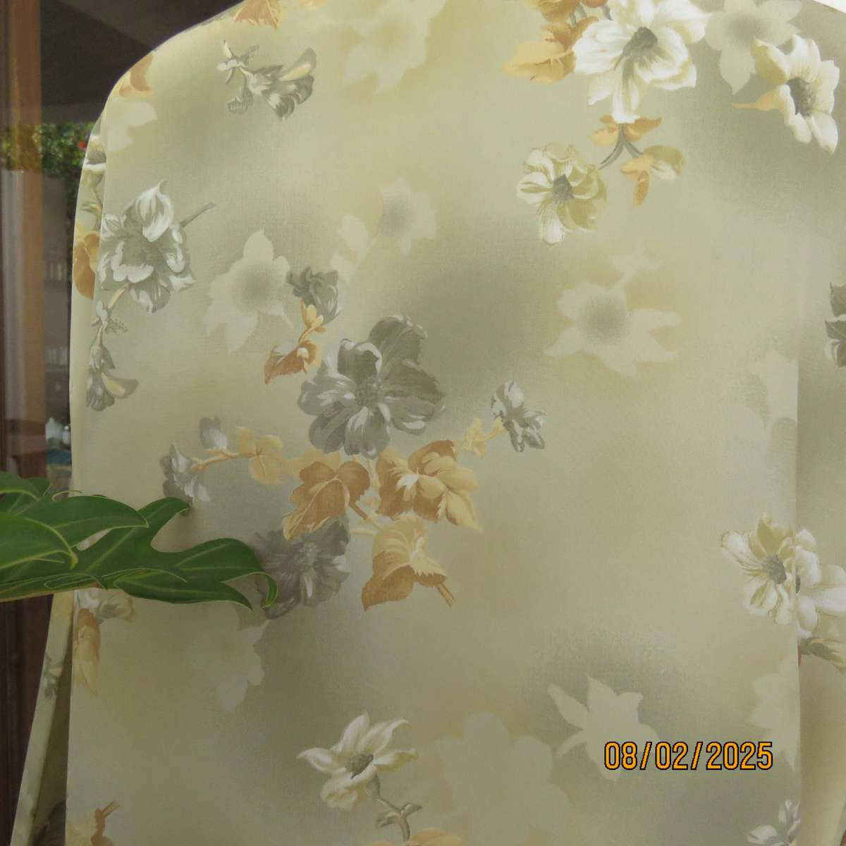 Moss green textured polyester long sleeve top with green-gold flowers. Size 44