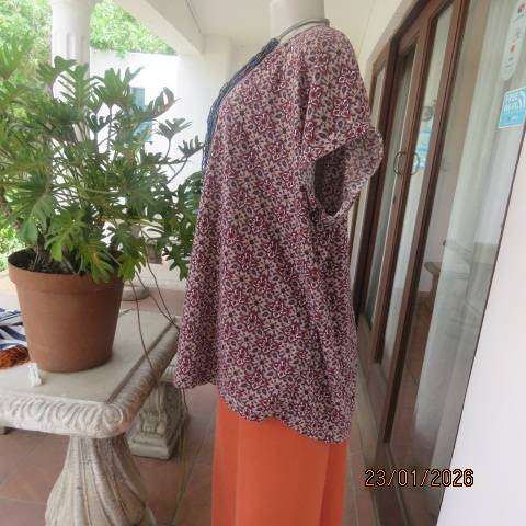 Ecru colour polycotton top with navy-cream-burnt orange graphic print. Tiny cut on sleeves. Size 46