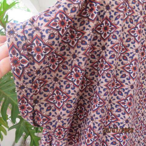 Ecru colour polycotton top with navy-cream-burnt orange graphic print. Tiny cut on sleeves. Size 46