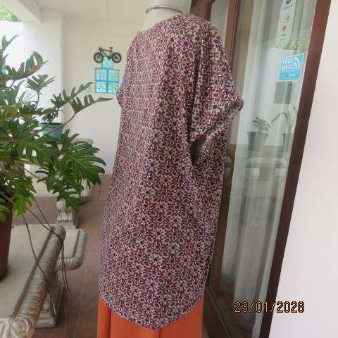 Ecru colour polycotton top with navy-cream-burnt orange graphic print. Tiny cut on sleeves. Size 46